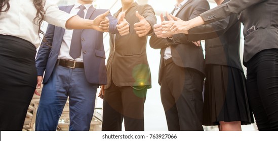 Team Business Partners Giving Thumb up Bump after Complete a deal. Successful Teamwork Partnership in an office. Businessman with hands together. business concept in city