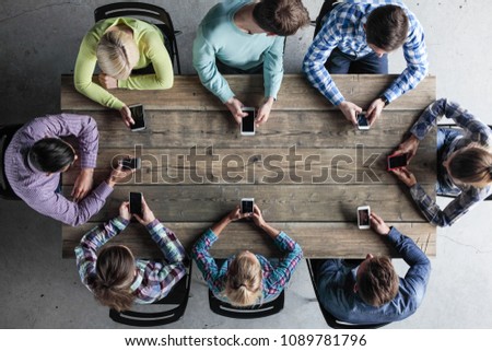 Similar – Young people on a smartphone