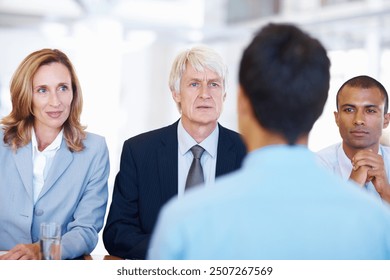 Team, business people and job seeker in office for interview, questions and hiring process for corporate. Interviewer, human resources staff or candidate in boardroom for recruitment, answer or intro - Powered by Shutterstock