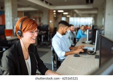 Team of business people working in a call centre on the line.