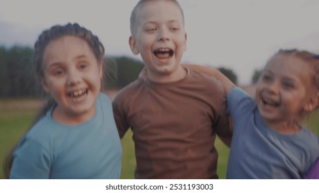 team children hugging jumping shouting rejoice success. happy family kid dream concept. a group of children embraced in nature in the park play jump hug together. teamwork lifestyle concept - Powered by Shutterstock