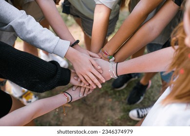 Team of children put hands together.Peaceful Protest kids group and protester unity in a fist of diverse people connected together as a nonviolent resistance symbol of justice and fighting - Powered by Shutterstock