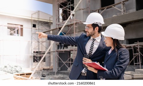Team of Civil engineer manager checking work with clipboard  for Inspection to management team in the construction site.Achitecture in under construction site.Leadership success concept.