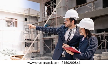 Team of Civil engineer manager checking work with clipboard  for Inspection to management team in the construction site.Achitecture in under construction site.Leadership success concept.