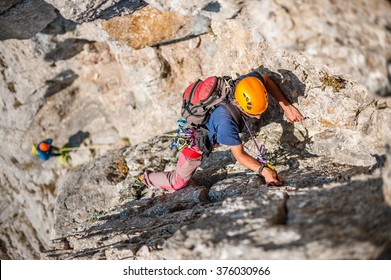 Team Of Climbers On The Rock.