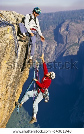 Similar – Rock climbing team bivouaced in a storm.