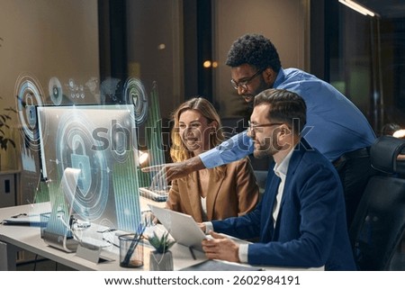 Team collaborating on cybersecurity solutions, analyzing futuristic hologram interfaces in office setting.