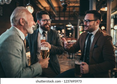 Businessmen Socializing Bar After Work Stock Photo (Edit Now) 1241994334