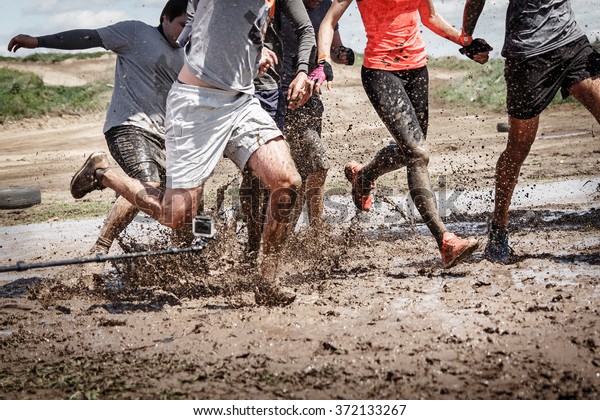 Team competition with an obstacle. Finish team\
in a big mud puddle.\
Close-up