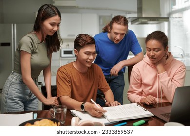 Team of computer science students working on project of mobile application