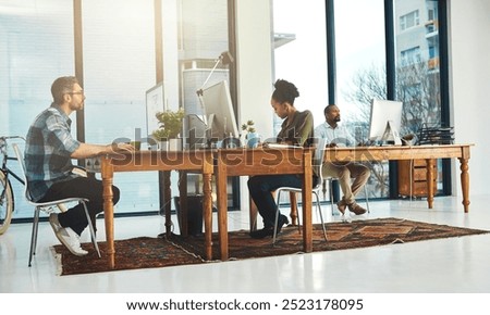 Team, computer or typing in office for creativity, market research or storytelling at creative agency. People, diversity or technology at table for SEO, brainstorming or proofreading article in city