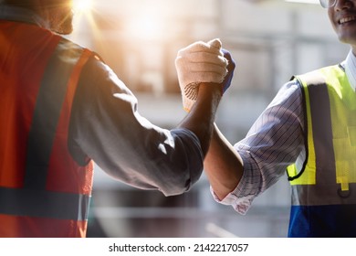 Team Construction or engineering group and worker. Teamwork and determination to succeed. Safety hard hat to prevent accident while working Transport and Container Team. Concept Restart and new Normal - Shutterstock ID 2142217057