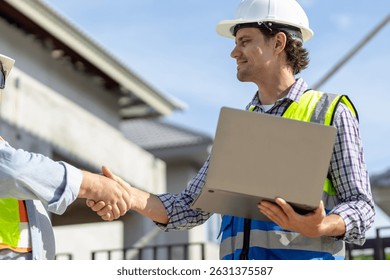 Team Construction or engineering group and worker.  Concept Restart and new Normal Two engineer shaking hands with deals and congratulations on success.