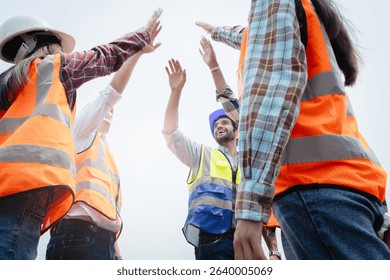Team Construction or engineering group and worker. Teamwork and determination to succeed. Safety hard hat to prevent accident while working Transport and Container Team. Concept Restart and new Normal