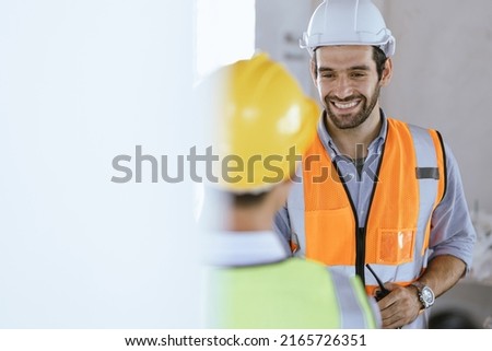 Team Construction or engineering group and worker. Teamwork and determination to succeed. Safety hard hat to prevent accident while working Transport and Container Team. Concept Restart and new Normal