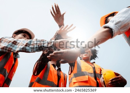 Team Construction or engineering group and worker. Teamwork and determination to succeed. Safety hard hat to prevent accident while working Transport and Container Team. Concept Restart and new Normal