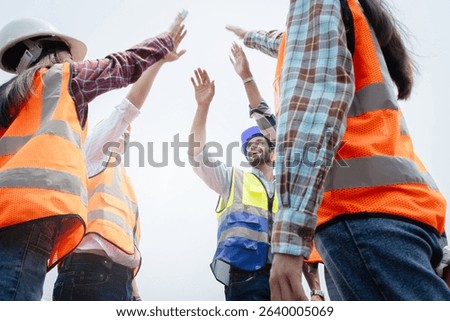 Team Construction or engineering group and worker. Teamwork and determination to succeed. Safety hard hat to prevent accident while working Transport and Container Team. Concept Restart and new Normal