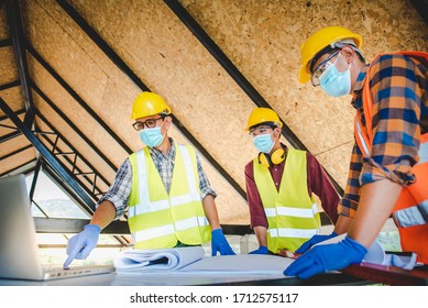 A Team Of Construction Engineers And Three Architects Are Ready To Wear Medical Masks. Corona Or Covid-19 Wear Masks During The Design Of Construction.