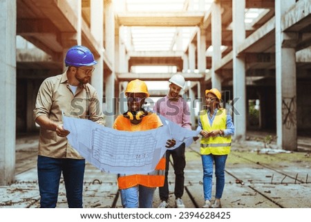 Team of construction workers discussing project details with executive supervisor. Group of architects and civil engineers inspecting construction site. Structural engineer and architect discussing.