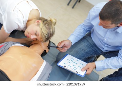 Team Of Coworkers During Hospital Training Dummy