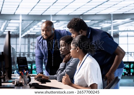 Team of data center office computer scientists using programming languages to construct algorithms and build applications. Teamworking server farm IT specialists debugging and optimizing code