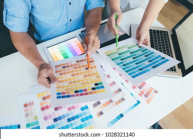 Team of Designer working at office. Designers brainstorming meeting team. - Powered by Shutterstock