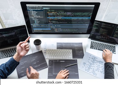 Team Of Developer Programmer Working On Project In Software Development Computer In IT Company Office, Writing Codes And Data Code Website And Coding Database Technologies To Find Problem Solution.