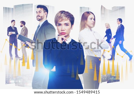 Team of diverse business people working together in abstract city with double exposure of graphs. Concept of teamwork and market analysis. Toned image