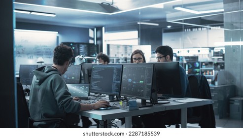 Team of Diverse Multiethnic Software Developers Working on Computers, Sitting Together in One Department. Researching and Providing Technical Support Online