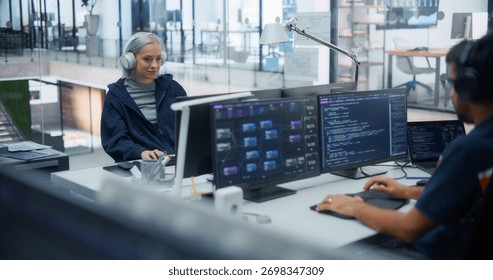 Team of Diverse Multiethnic Software Developers Working on Computers, Developing Artificial Intelligence Projects. Portrait Focused on Creative Female Specialist Wearing Headphones