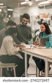 Team of diverse professionals engaging in a collaborative discussion and planning session, working together at an modern office table