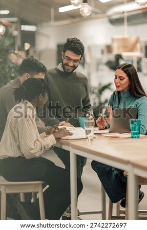 Team of diverse professionals engaging in a collaborative discussion and planning session, working together at an modern office table