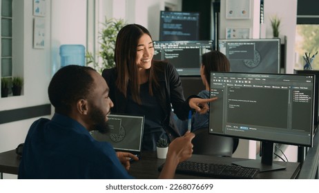 Team of diverse programers doing highfive gesture after coding database, celebrating cloud computing achievement. Successful firewall server development with it software language.