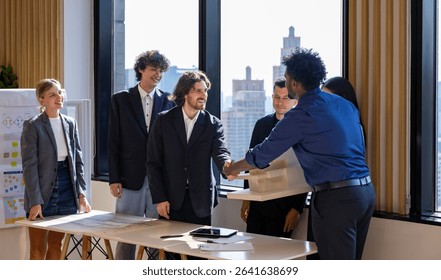 Team of diversity business people having agreement and handshake deal over new strategic strategy project on investment real estate with recognition and applause from other colleagues for partnership - Powered by Shutterstock - Get 15% off with code: PIKWIZARD15