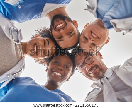Team, diversity and doctors in circle from below, teamwork, support and help from hospital staff. Group of medical workers in huddle looking down head together. Teammates, men and women in healthcare