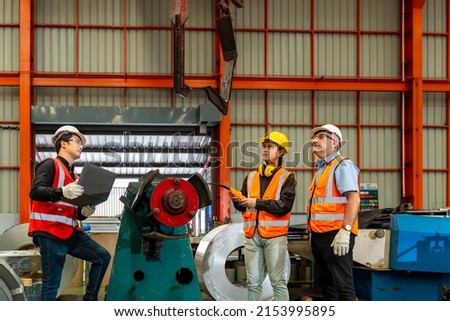 Team of diversity worker inspecting inside the steel manufacturing factory while listening to senior manager advice on improvement of capacity and productivity