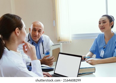 Team Doctor, Nurse And Internship Doctor Talking And Discussing About Surgery Treatment Patientâ€™s Case While Sitting In The Meeting Room Office In Hospital. Healthcare And Medical Concept.