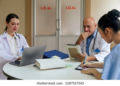 Team Doctor, Nurse And Internship Doctor Talking And Discussing About Surgery Treatment Patient’s Case While Sitting In The Meeting Room Office In Hospital. Healthcare And Medical Concept.