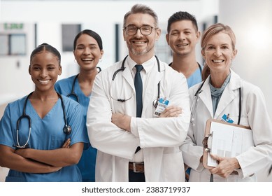 Team of doctor and nurse with vision, teamwork and arms crossed while working at a hospital. Happy medical expert, healthcare and professional group smile at work together for success at a clinic - Powered by Shutterstock