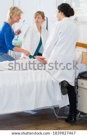 Similar – Doctor giving a prescription to senior patient