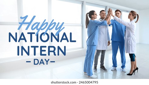 Team of doctors giving each other high-five in clinic. Banner for National Intern Day - Powered by Shutterstock