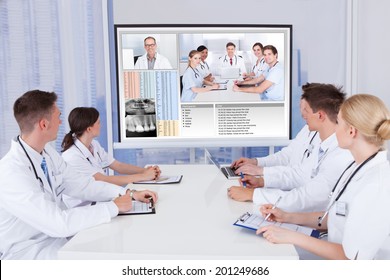Team of doctors having video conference meeting in hospital