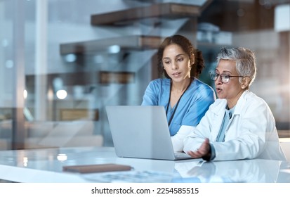 Team of doctors, healthcare and women with laptop, working together and digital hospital schedule or agenda. Technology, medical innovation and collaboration, partnership and cardiovascular surgeon - Powered by Shutterstock