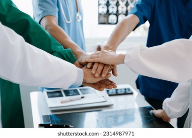 Team Doctors nurses union coordinate hands Teamwork Concept in hospital for success and trust in the team.