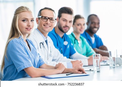 Team Doctors Sitting Table Row Looking Stock Photo 752236837 | Shutterstock