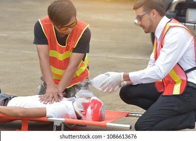 Team Of Emergency Medical Staff Rescuing Patient