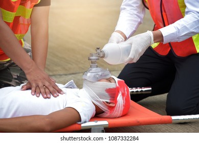 Team Of Emergency Medical Staff Rescuing Patient