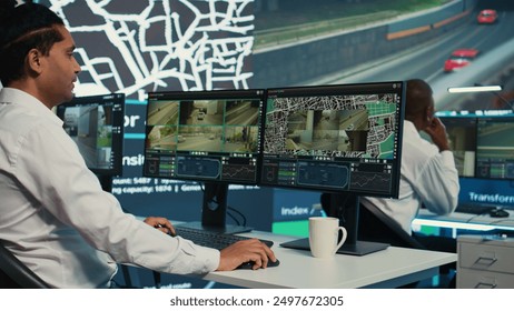 Team of employees monitoring delivery trucks with gps coordinates on satellite navigation, tracking orders with awb shipping system. Operators working in control center. Camera B. - Powered by Shutterstock