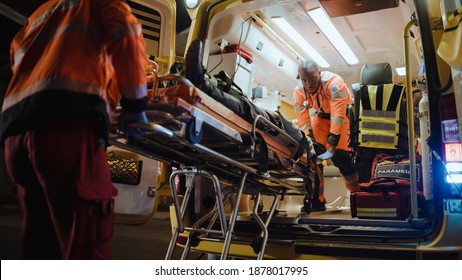 Team of EMS Paramedics React Quick to Bring Injured Patient to Healthcare Hospital and Get Him Out of Ambulance on a Stretcher. Emergency Care Assistants Help Young Man to Stay Alive After Accident. - Powered by Shutterstock