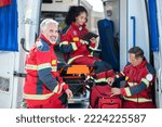 Team of EMS workers getting ready for the shift